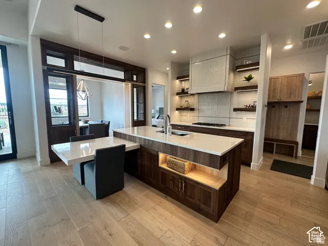 Light wood-finish flooring complements the dark wood-finish cabinetry