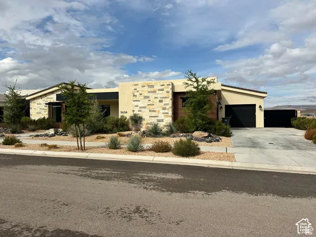 Contemporary stucco exterior with stone accents