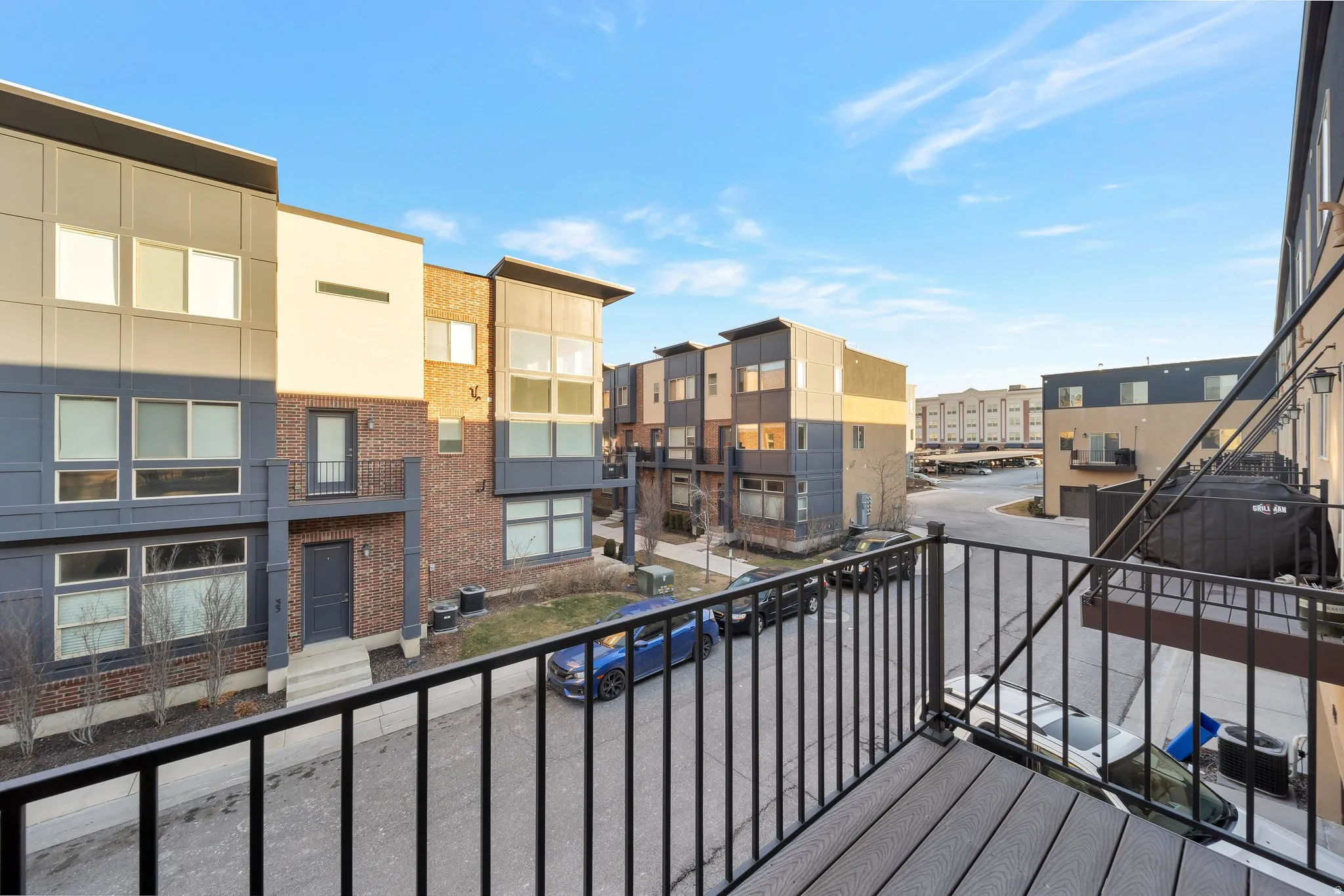 Modern architectural design featuring varied facade materials including brick, siding, and stucco