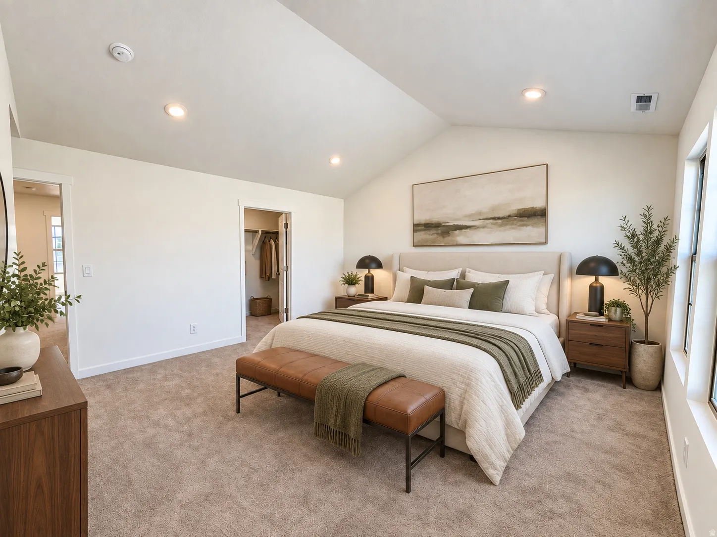 Vaulted ceiling, recessed lighting, carpet flooring, walk-in closet, and natural light from windows