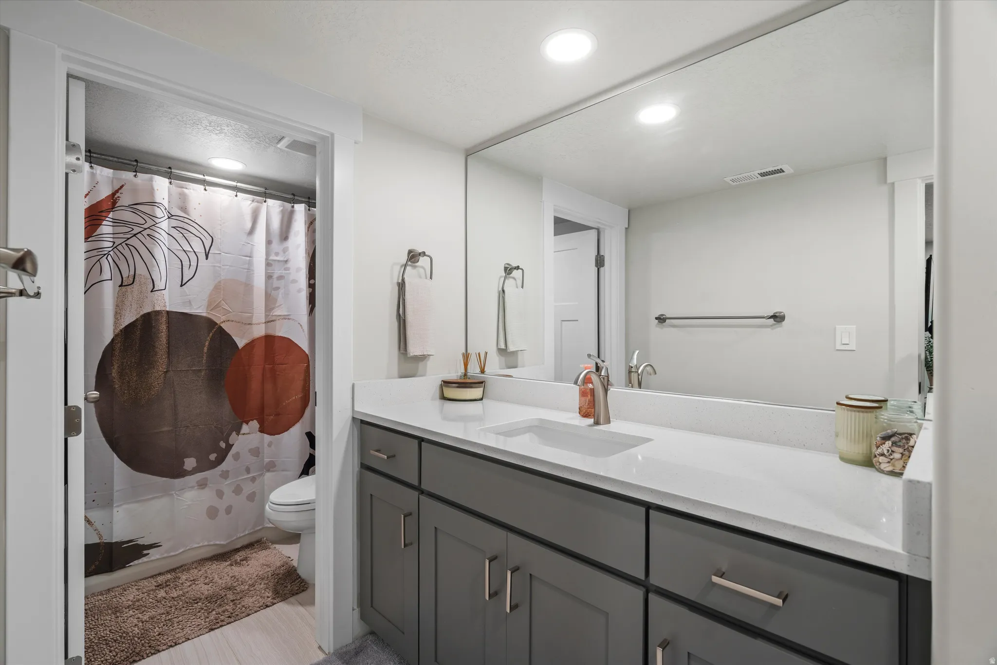Full bathroom in the basement servicing both guest bedrooms #3, and #4.  As in all of the bathrooms, here you will find quartz counters.