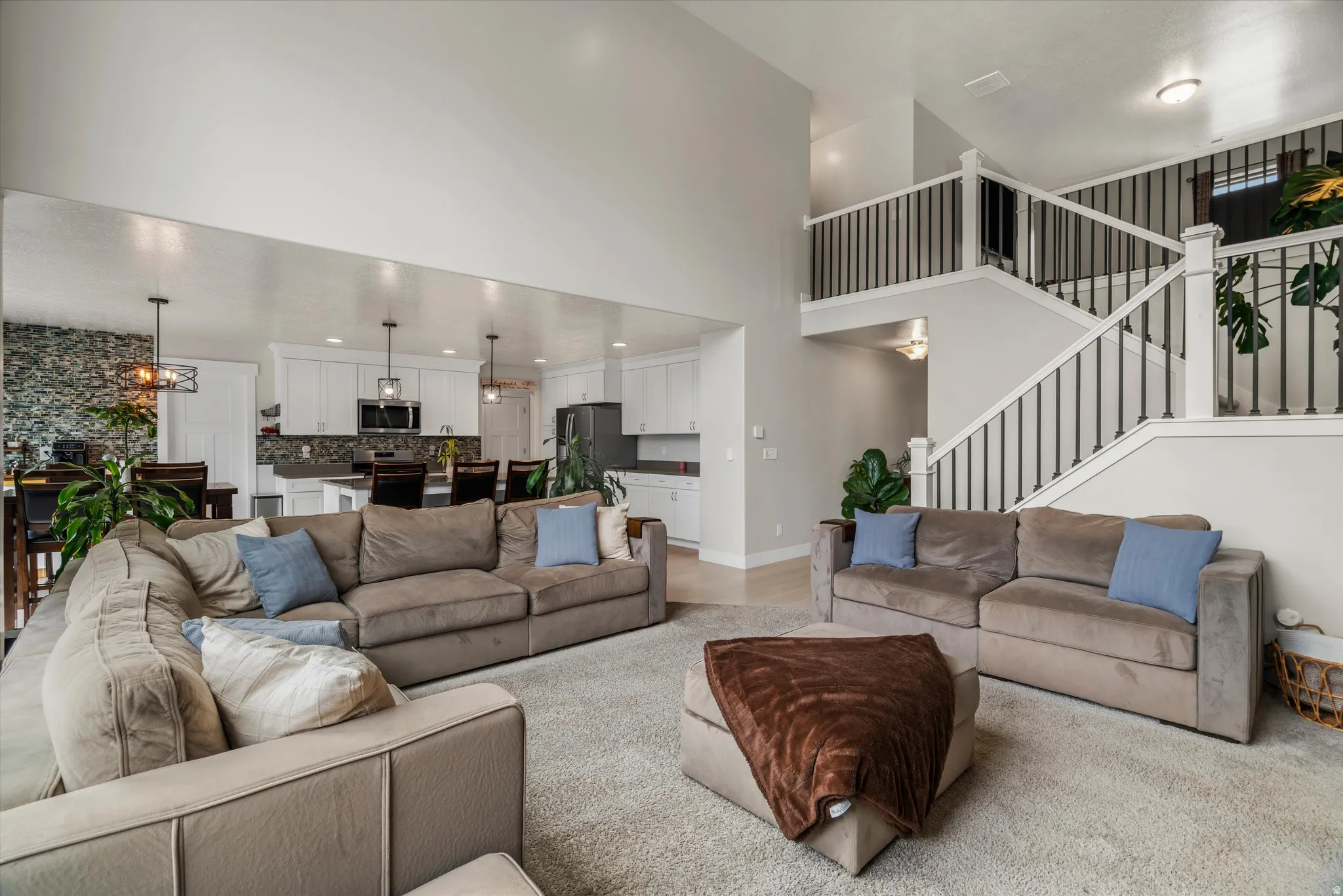 Adjacent to the living room is the open kitchen!  Sunlight flows in from both the living room and side slier!