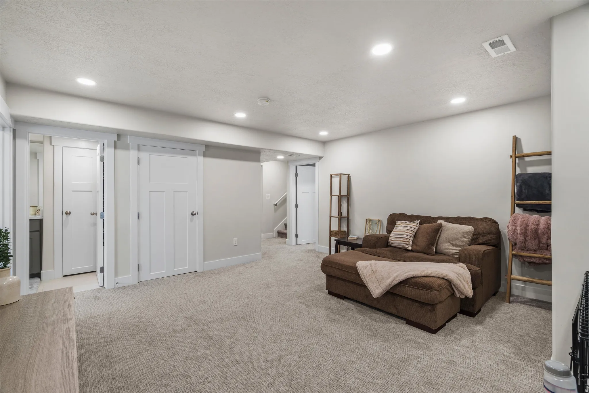 In the basement is large family room that is centered between two additional guest bedrooms and a large flex room!