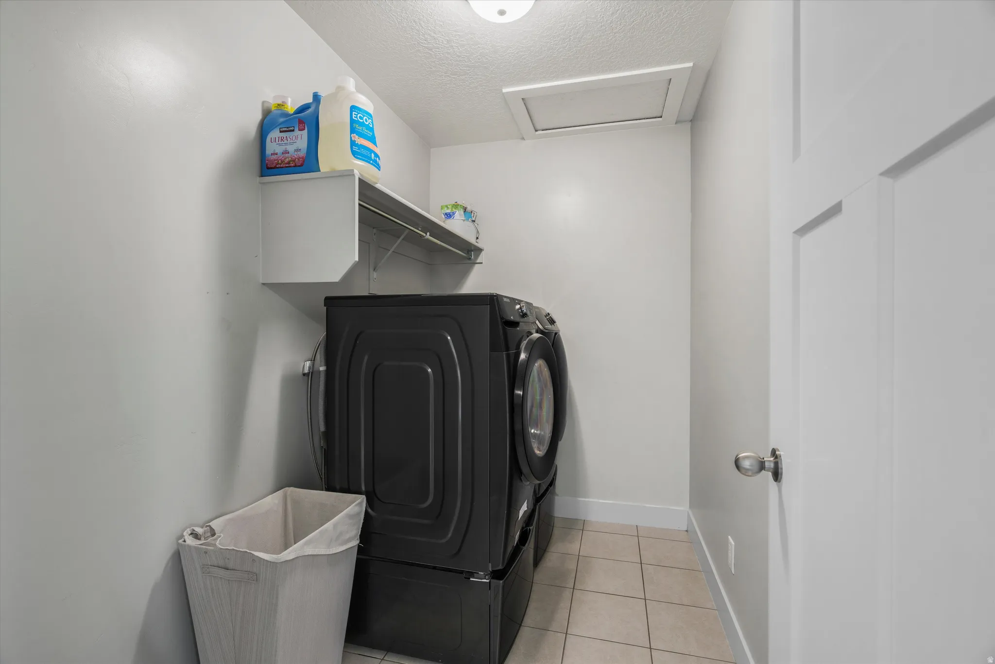 The laundry room is upstairs near both guest bedrooms, primary bedroom and the loft.