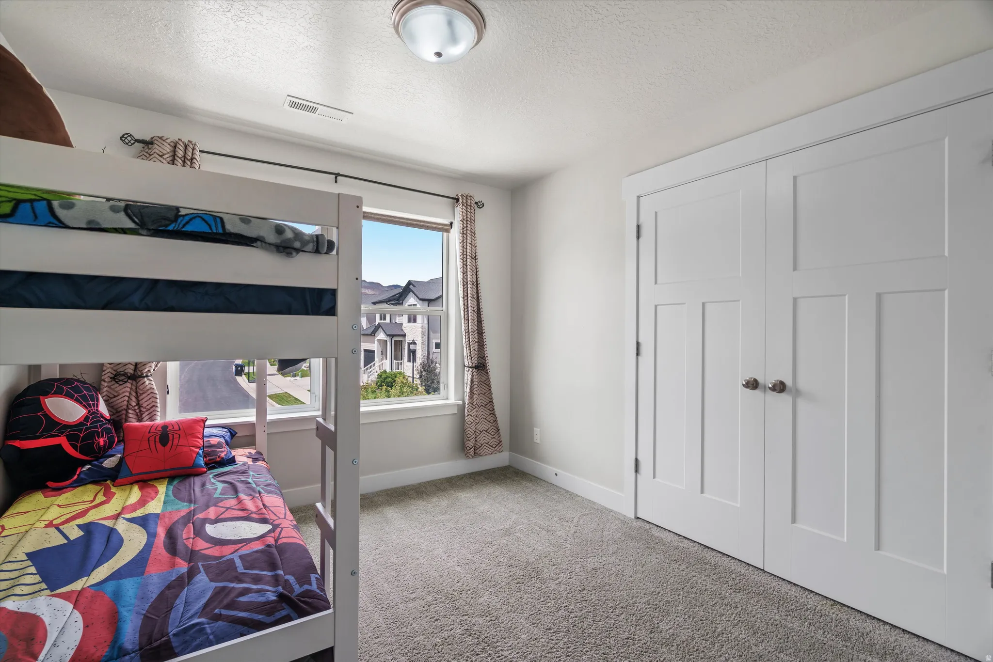Guest bedroom #1 with west facing views, and a large closet.
