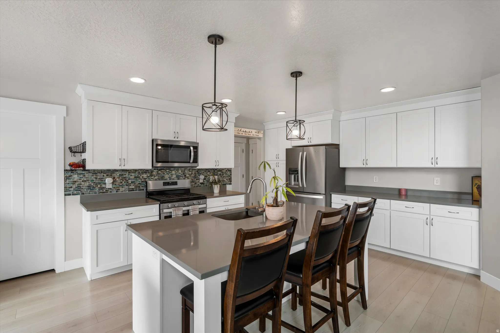 To the left of the cabinets, behind the door is a huge pantry!  Food storage will not be a problem here!