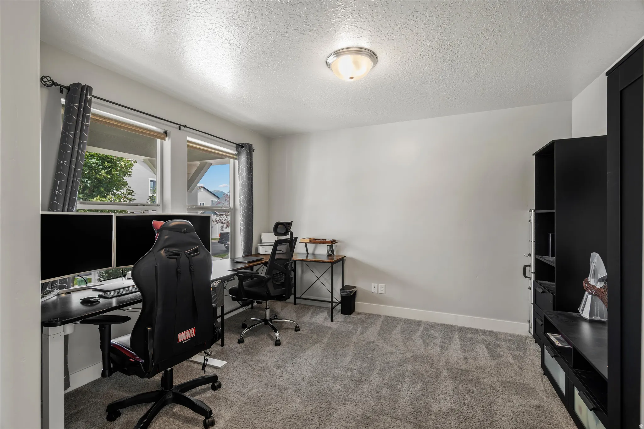 Right off of the foyer is a spacious office area.