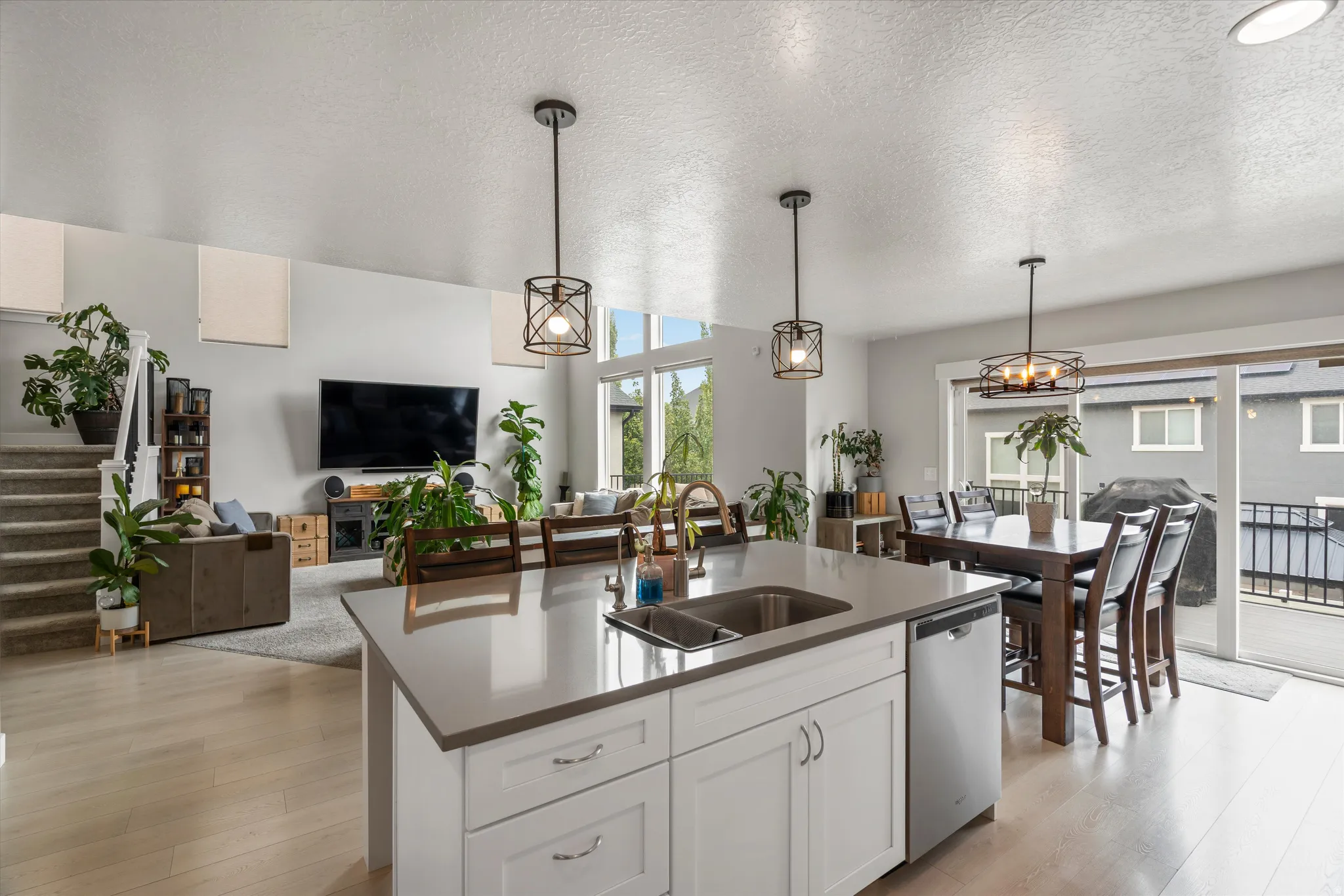At the right side of the kitchen is a slider that opens up to a large deck, making it perfect for entertaining guests and family!
