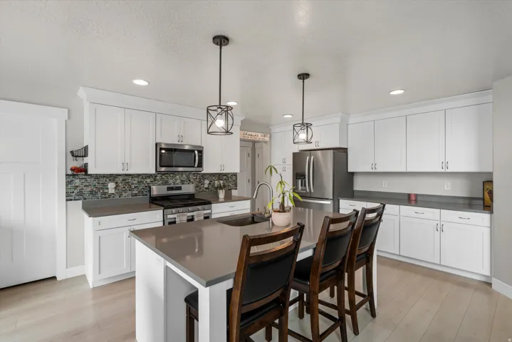 To the left of the cabinets, behind the door is a huge pantry!  Food storage will not be a problem here!