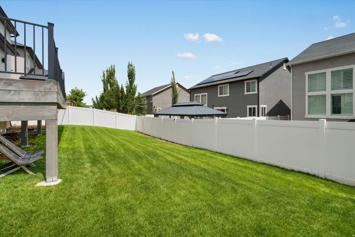 Fully fenced backyard below the deck area runs to both sides of the property - north & south.