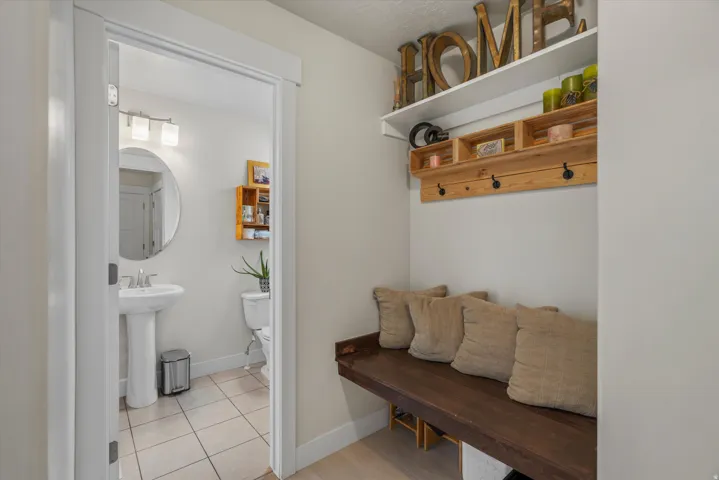 Mud room and half bath are off of the kitchen, and adjacent to the garage.