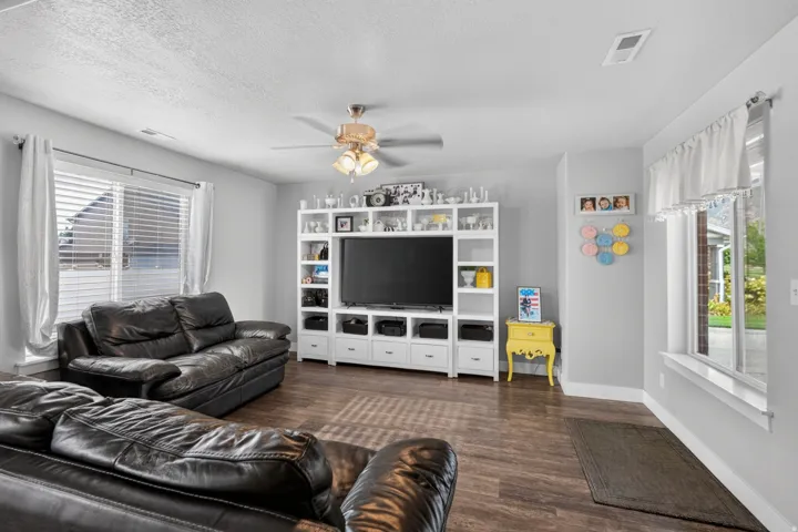 Hardwood-style flooring complemented by light-colored wall paint