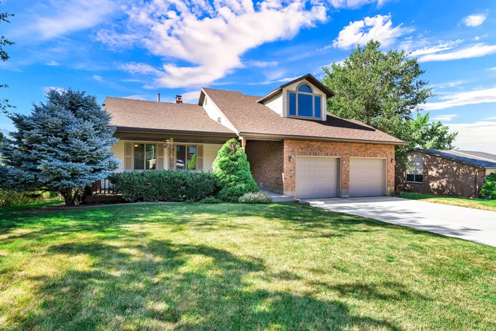 Brick facade with a covered porch.  Home faces North.