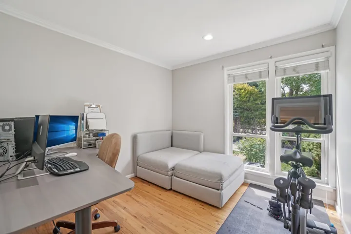 Hardwood flooring, recessed lighting, crown molding, and large windows with natural light