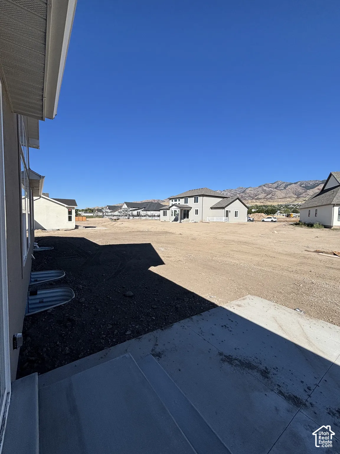 Concrete patio with direct access to undeveloped yard space