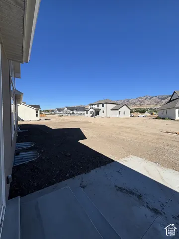 Concrete patio with direct access to undeveloped yard space
