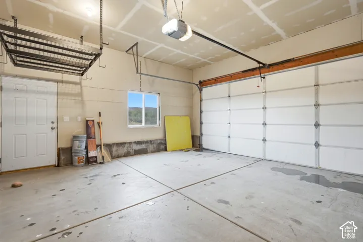 Spacious 2 car garage (AI removed personal belongings).