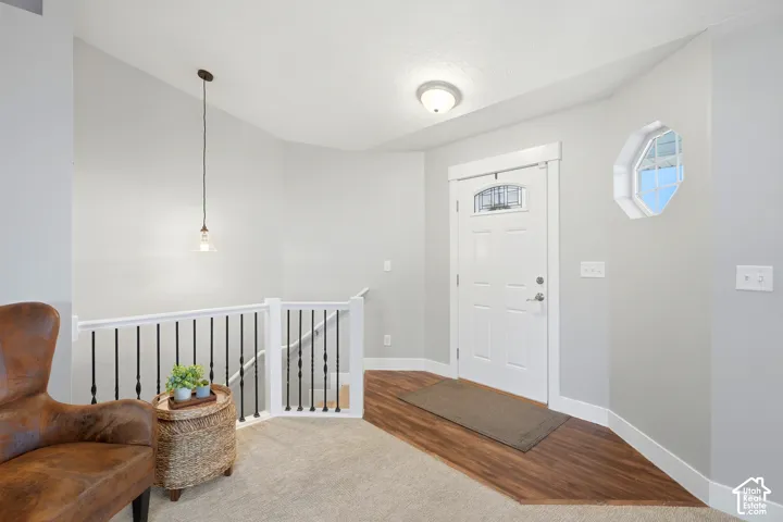 Entryway to living room or down to basement