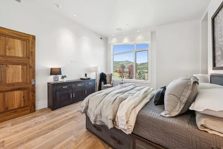Bright interior featuring wood-finish flooring and white walls
