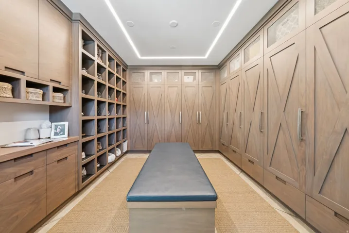 Custom built-in cabinetry and shelving throughout, featuring a natural wood-finish