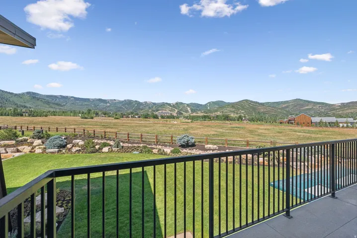 Expansive outdoor balcony with black metal railing