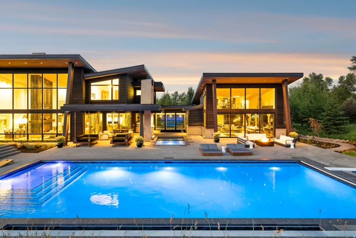 Contemporary architecture featuring extensive glazing and dark wood siding