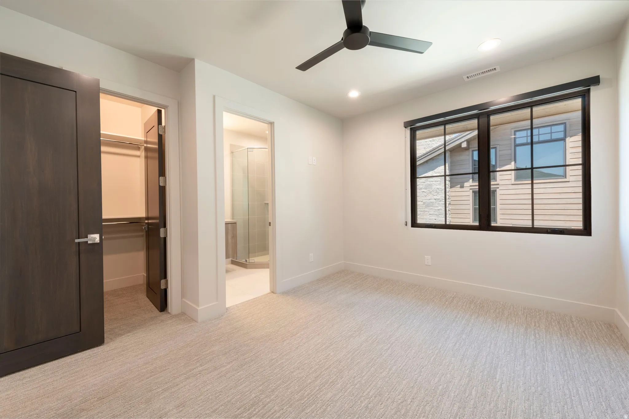 Neutral-toned carpeting throughout