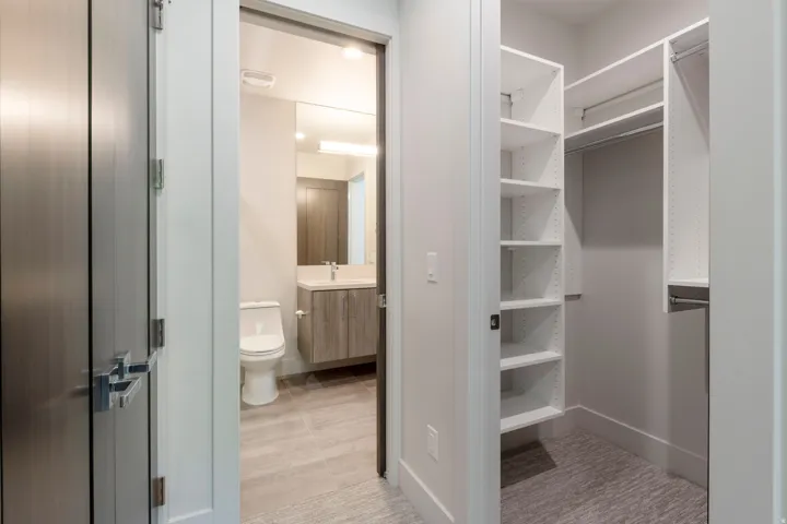 Walk-in closet with built-in shelving and hanging rods