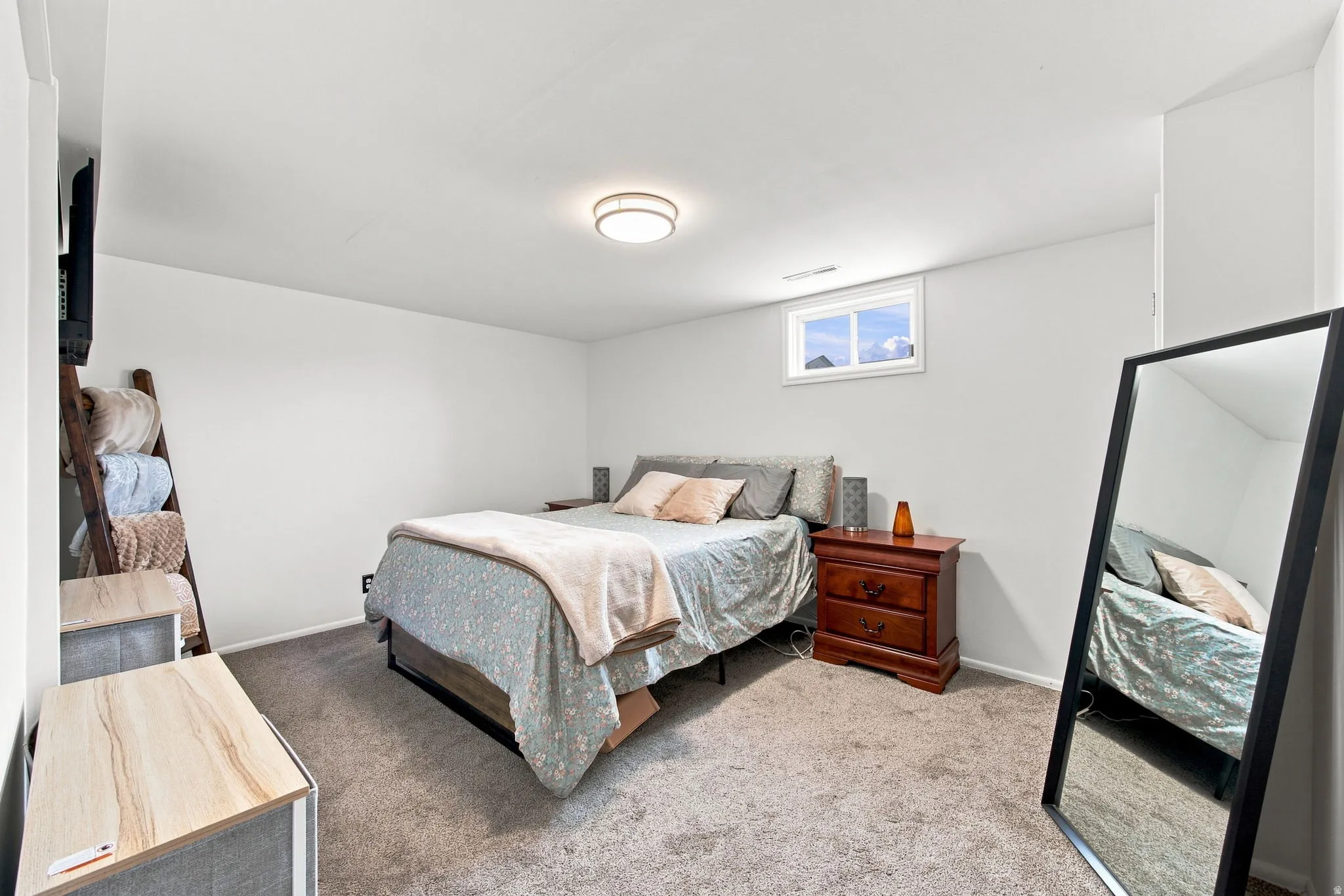 Recessed window with white trim, wall-to-wall carpeting, and a flush mount ceiling light