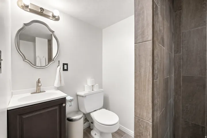 Vanity with integrated sink and brushed nickel faucet