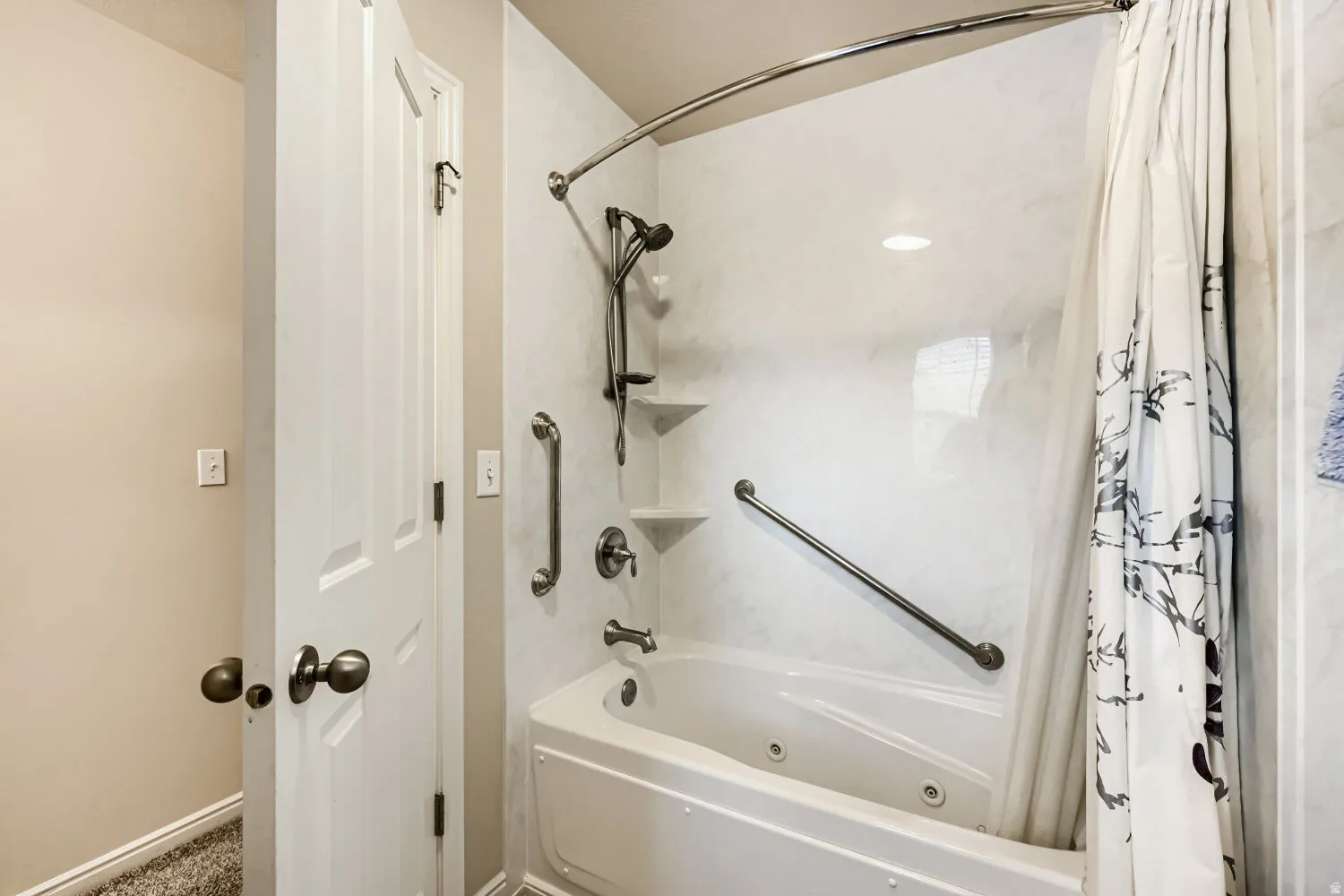 Jetted tub in the upstairs full bath, handheld sprayer and safety bars
