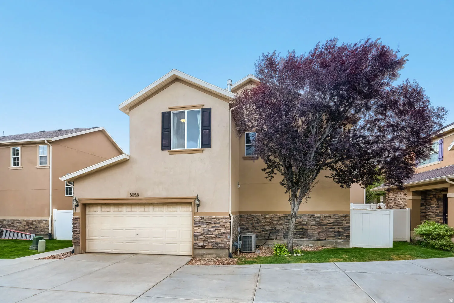Stucco exterior with stone veneer accents
