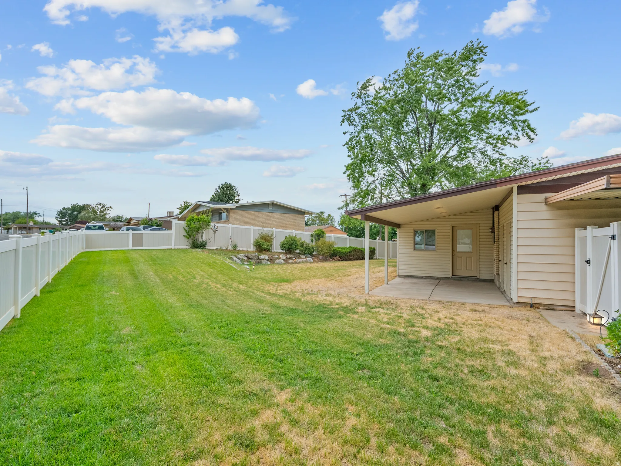 Expansive lawn with a full perimeter fence