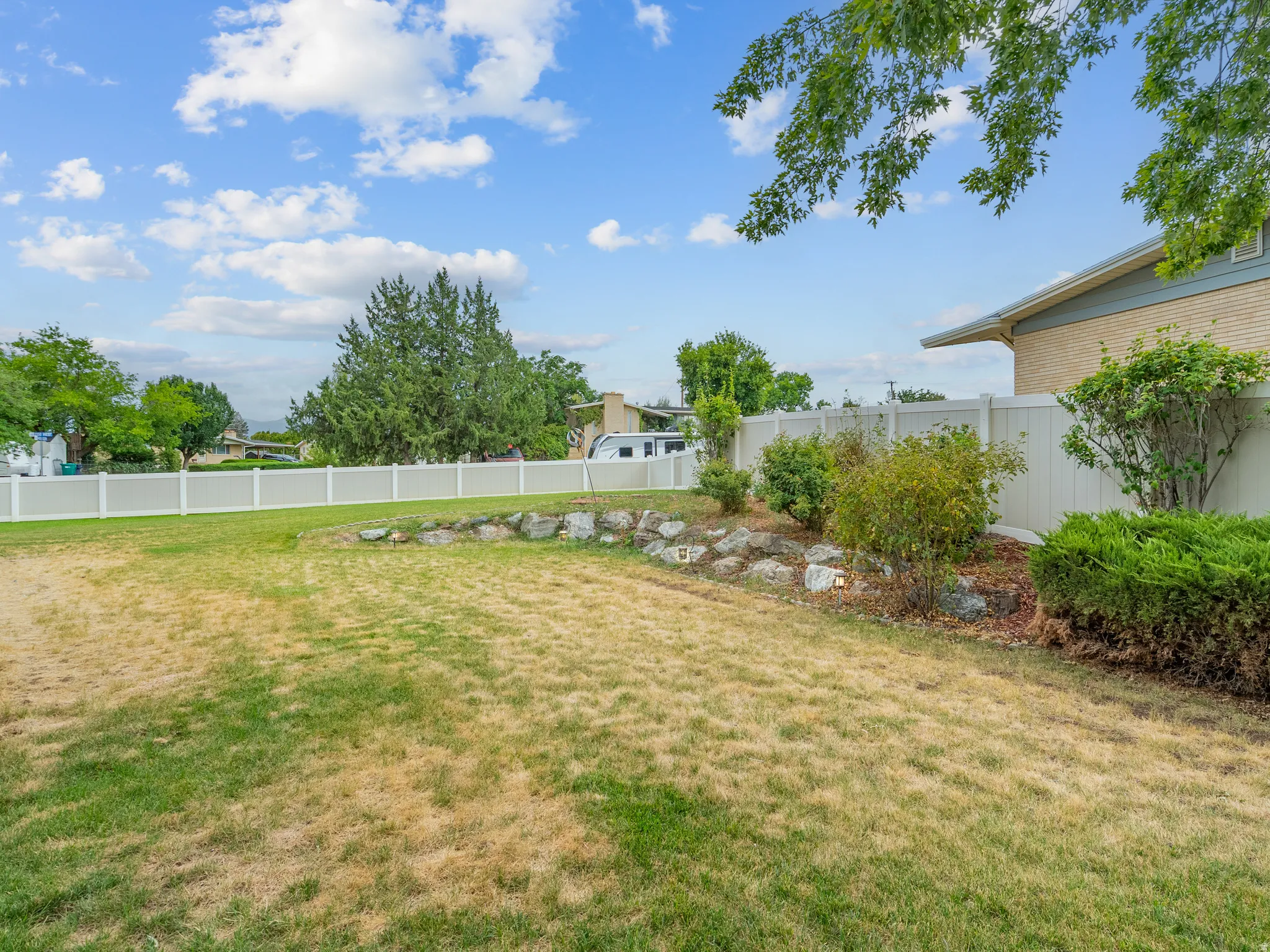 White privacy fencing enclosing the property