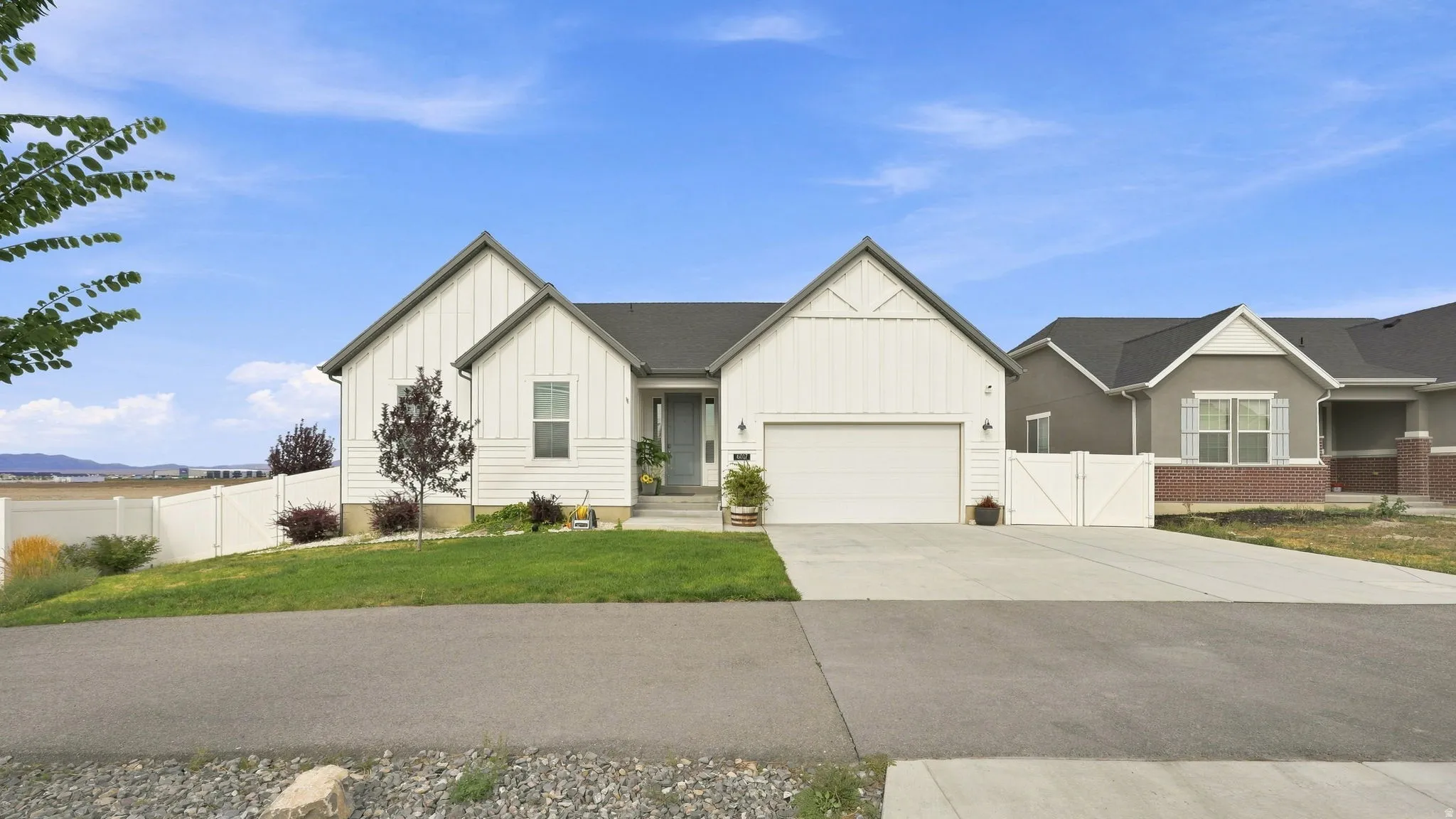 White vertical siding exterior with contrasting dark gray trim