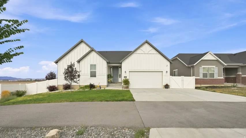 White vertical siding exterior with contrasting dark gray trim