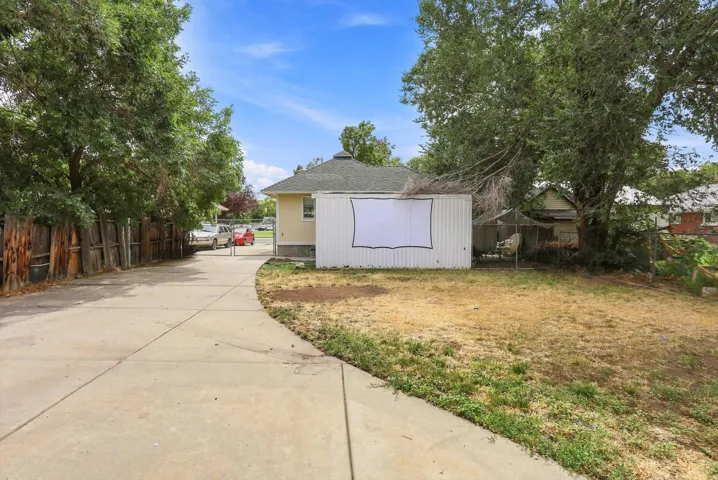 Concrete driveway extending to the rear of the property