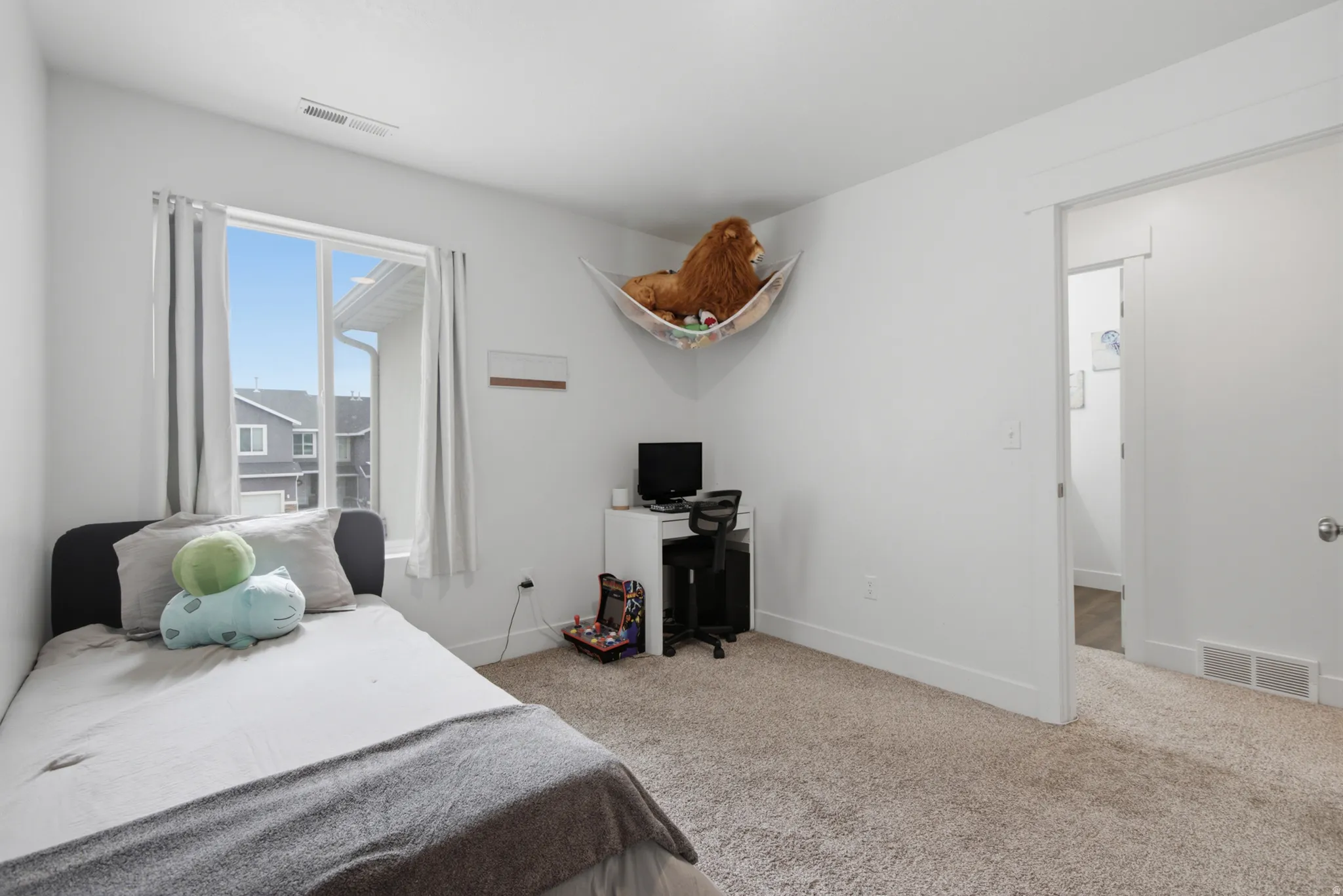 Recessed window with white trim, light-colored walls, and carpet flooring