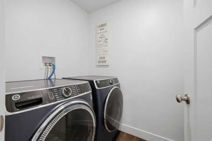 Dedicated laundry area with hookups for appliances and wood-finish flooring