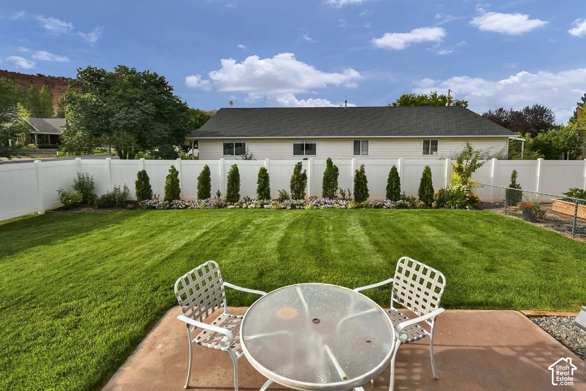 Expansive lawn with a concrete patio