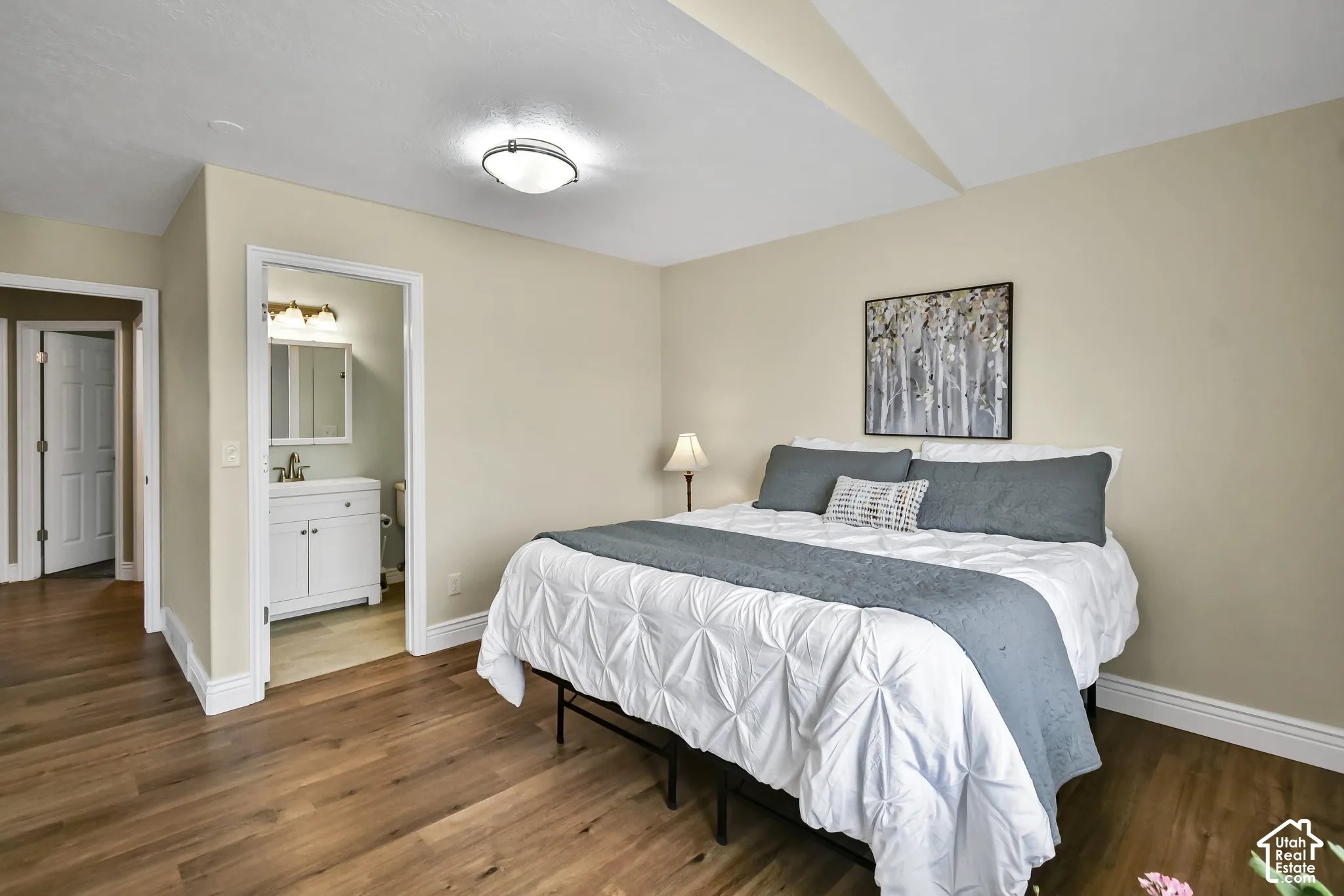Wood-finish flooring throughout, with a neutral wall palette