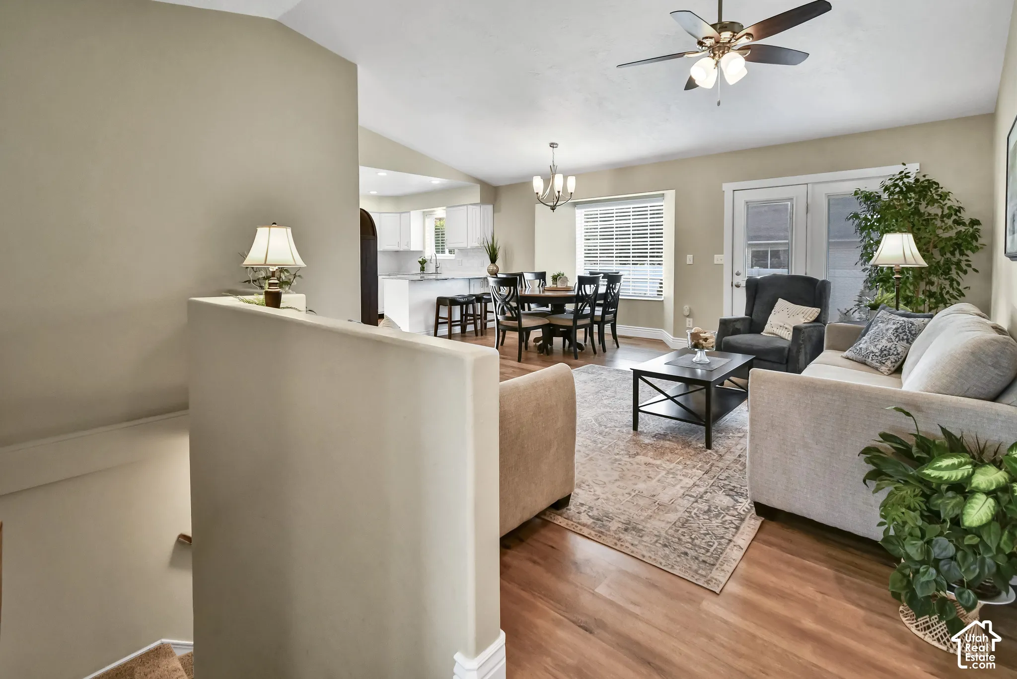 Open-concept living space featuring wood-finish flooring