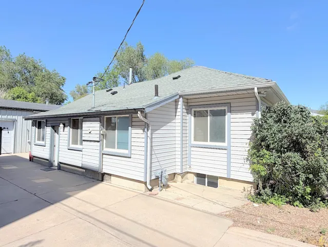 Light gray siding exterior with white window trim