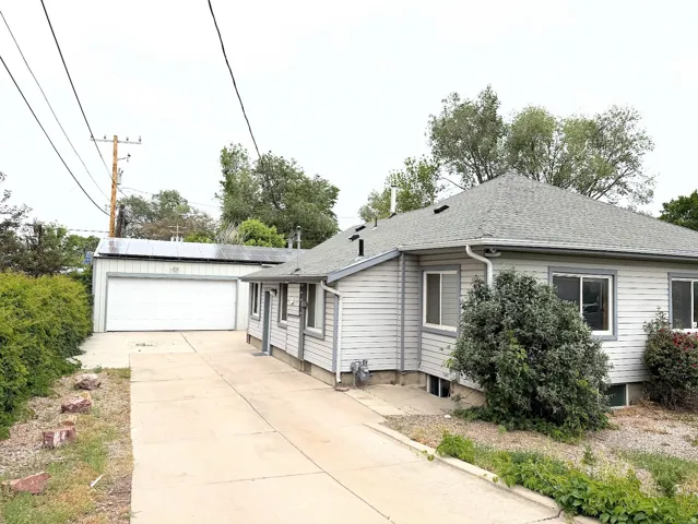Exterior featuring horizontal siding, a gabled roof, and multiple windows