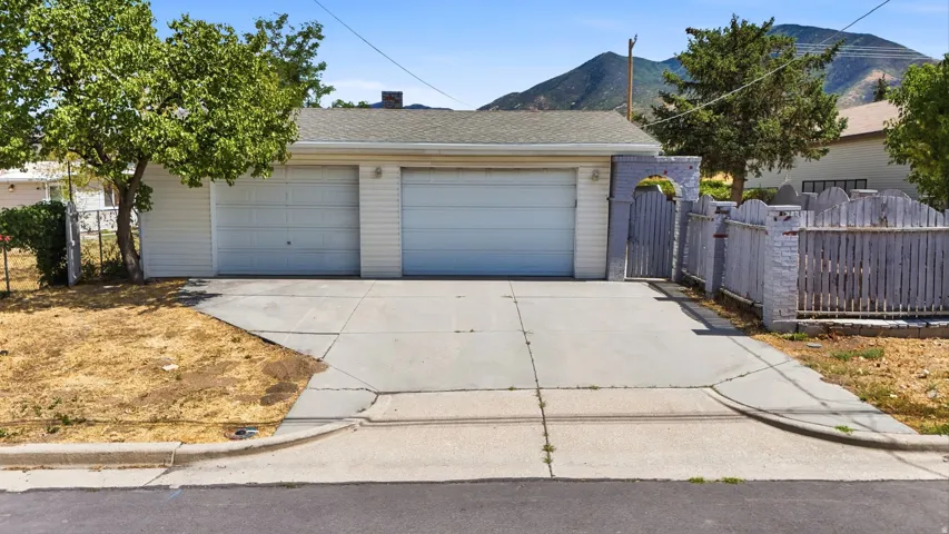 Two-car garage with white paneled doors