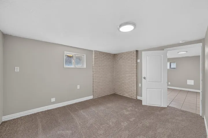 Wall-to-wall carpeting and neutral paint throughout