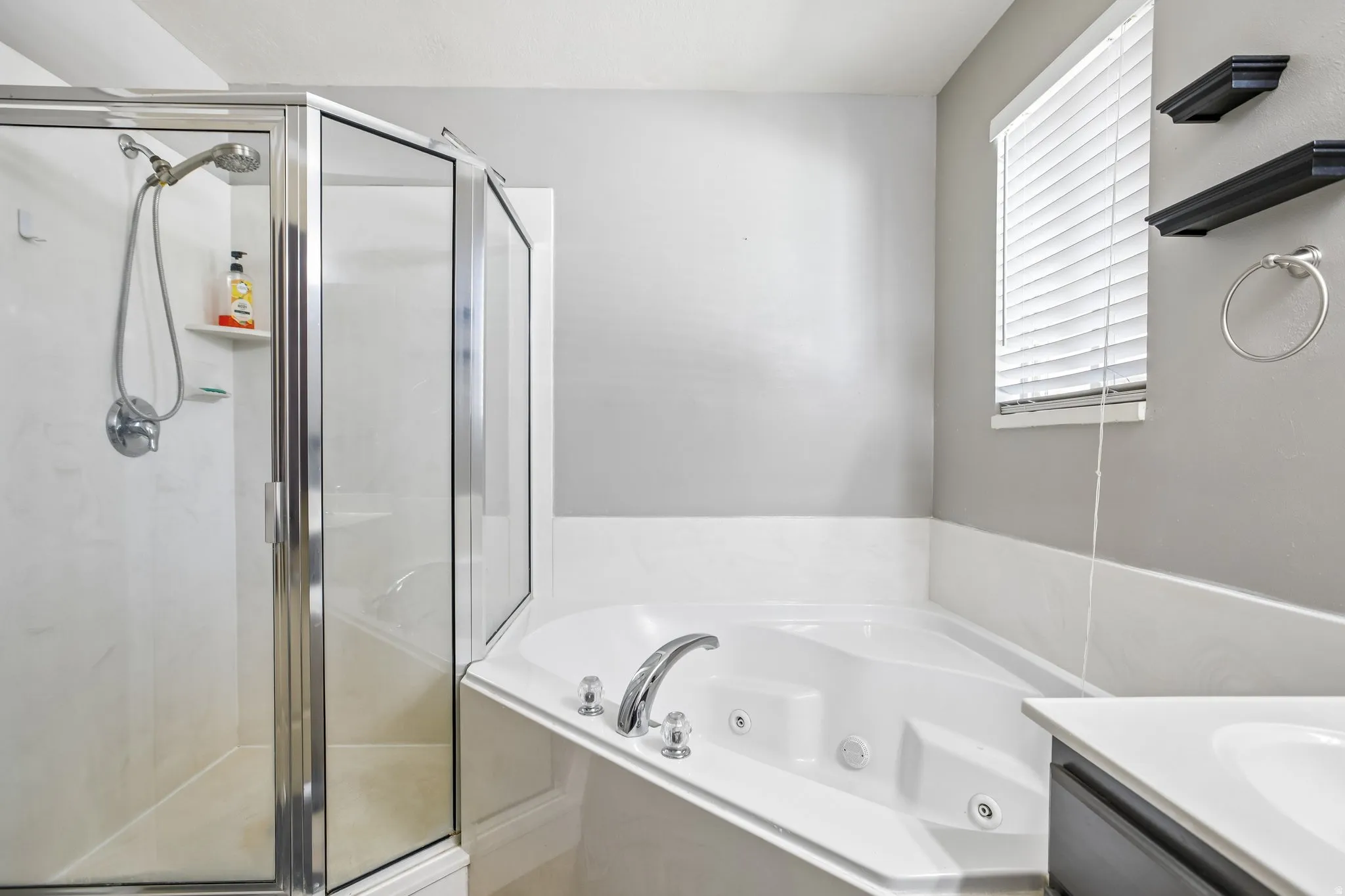 Walk-in shower with clear glass enclosure