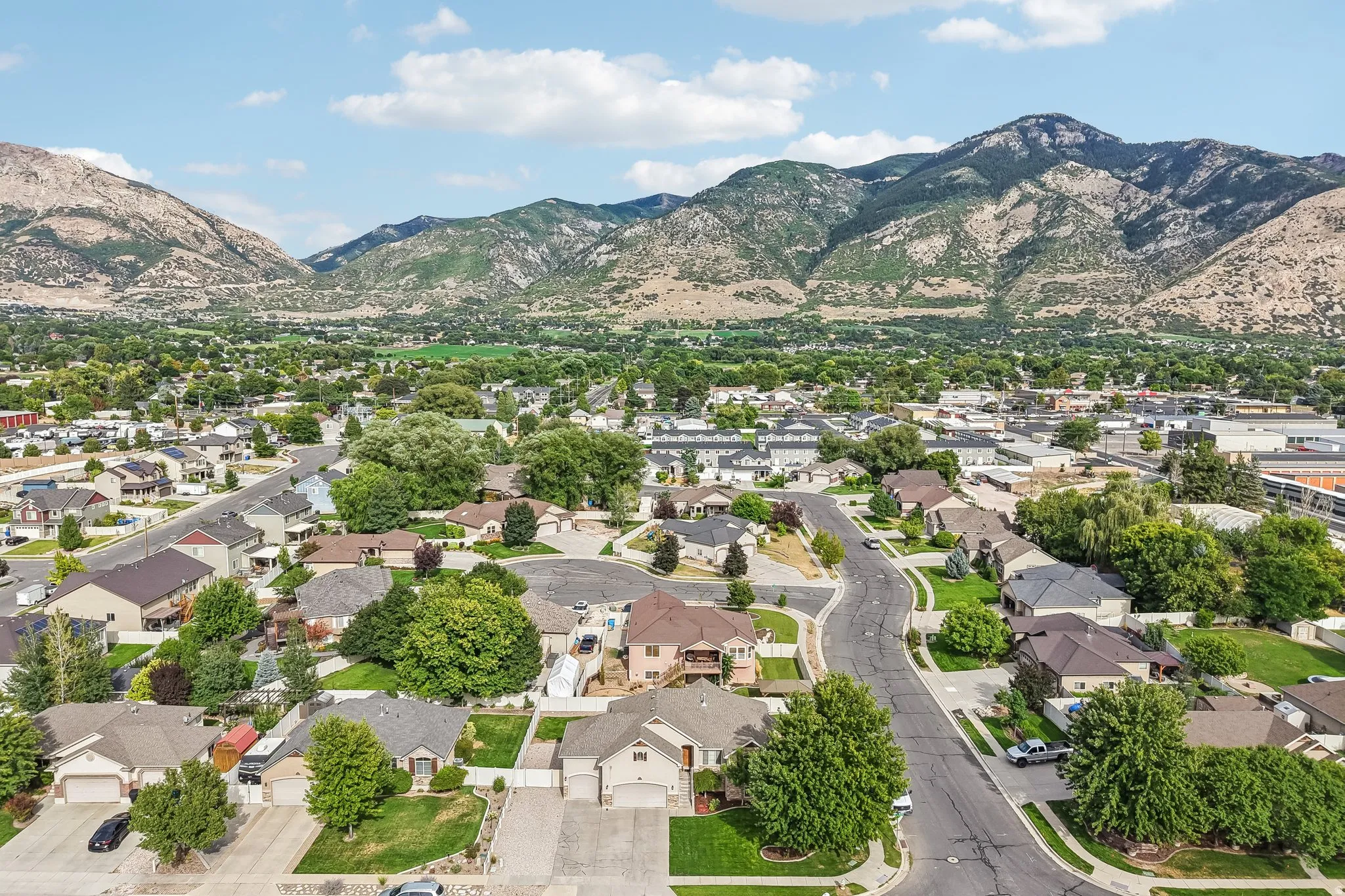 Mountain backdrop with residential properties and tree-lined streets