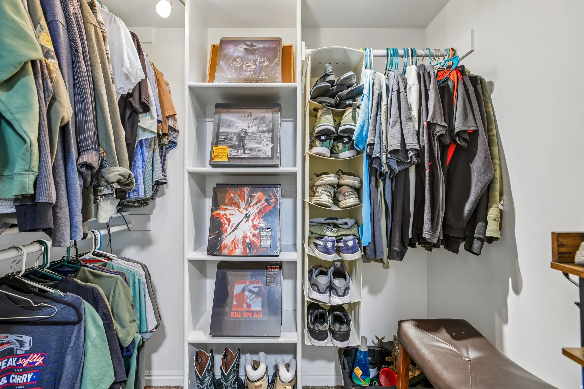 Built-in closet system featuring white shelving and hanging rods