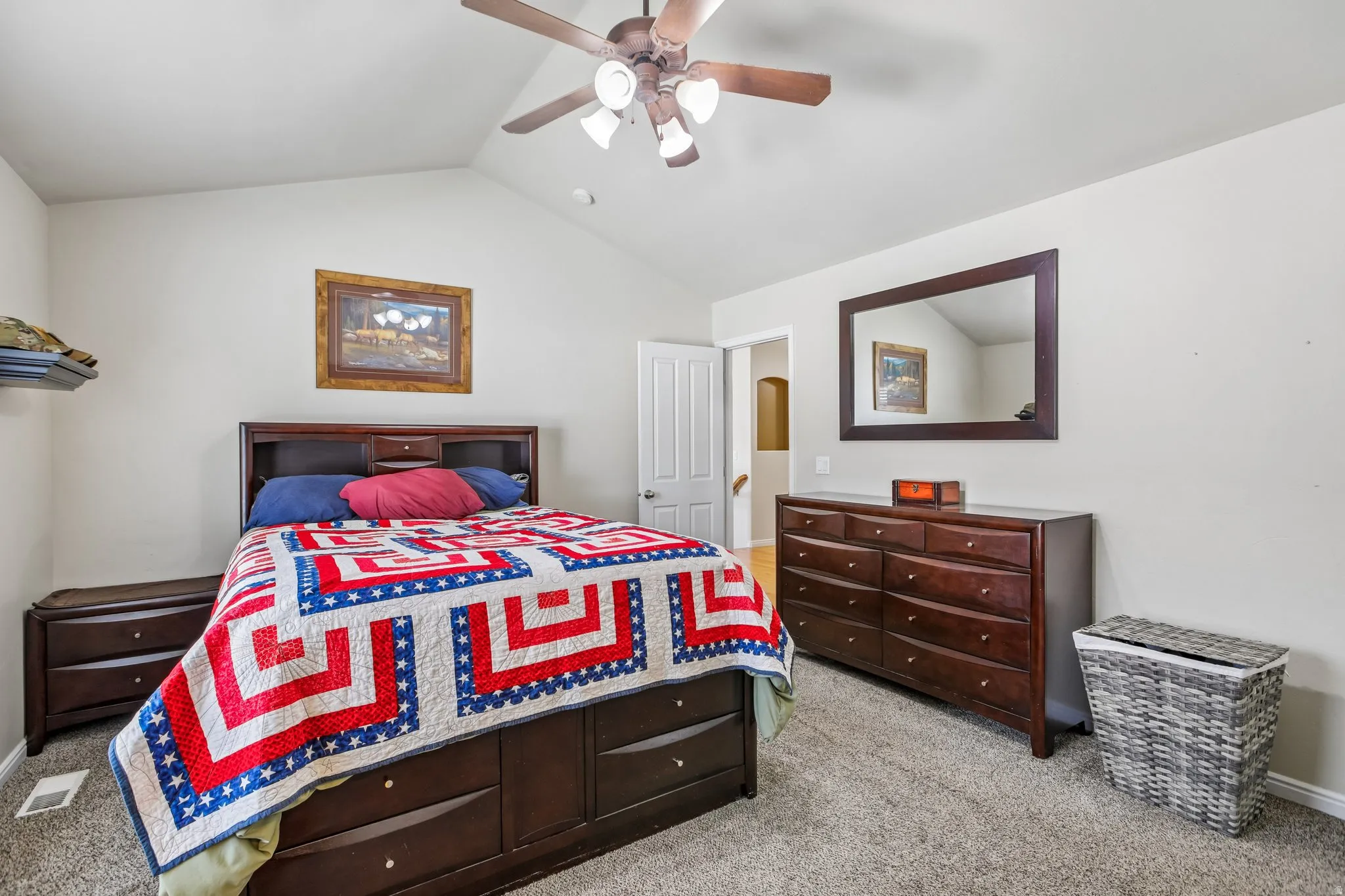Vaulted ceiling with a ceiling fan